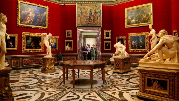 The Tribuna of the Uffizi, a domed octagonal room displaying paintings and statues.