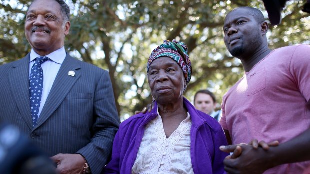 Offering support: Reverend Jesse Jackson with Nowai Korkoyah, the mother of Thomas Eric Duncan, and Mr Duncan's nephew, Josephus Weeks.