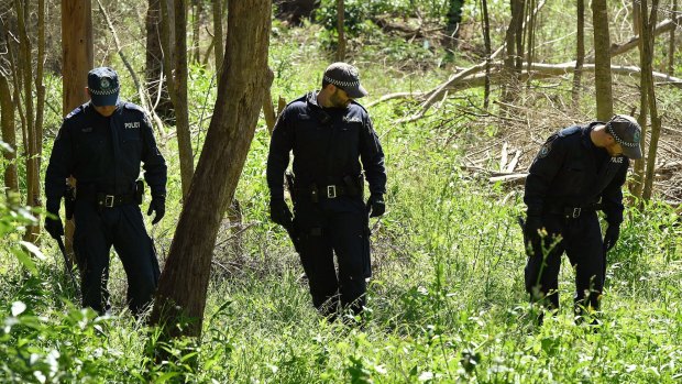 Police search for the murder weapon, as well as some of the victim's belongings, in Fred Caterson Recreation Reserve in Castle Hill in November.