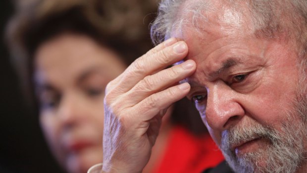 Brazil's former President Luiz Inacio Lula da Silva, right, has been sentenced to nearly 10 years in jail for corruption, but has not been jailed awaiting an appeal.