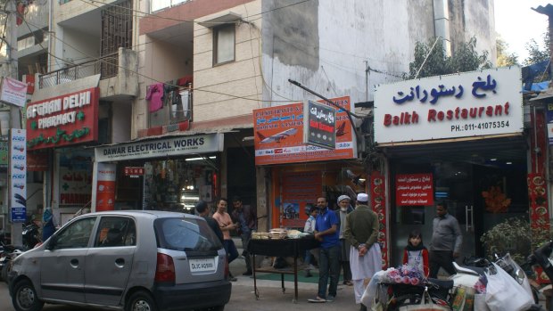 In Delhi's Little Kabul neighbourhood, an Afghan pharmacy, travel agent and restaurant.