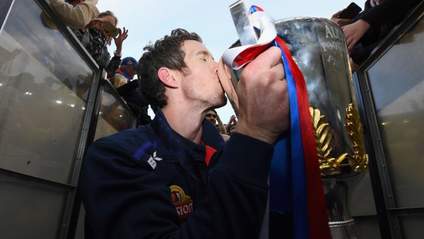 Injured Footscray skipper Bob Murphy  kisses the Premiership Cup after the Bulldogs' win over the Sydney Swans.