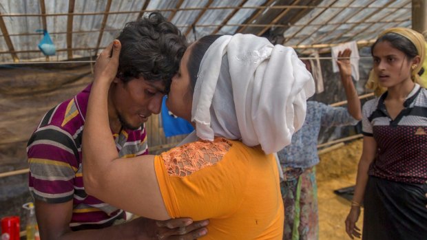 Nunhar Begum, a Rohingya Muslim woman who crossed over two weeks ago from Myanmar, is reunited with her son Nur Karim in Bangladesh, on Friday. 