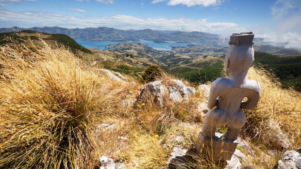 A Maori god overlooks Akaroa Harbour in the Canterbury Region of the South Island, New Zealand.