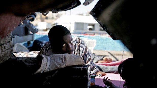 African illegal migrants receive medical assistance after being rescued by coastal guards on a port in Tripoli, Libya, last month. 