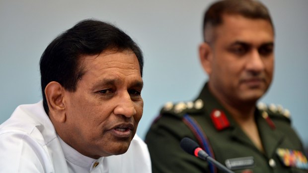 The Sri Lankan spokesman for President Maithripala Sirisena, Rajitha Senaratne, speaks as Army spokesman Brigadier Ruwan Wanigasooriya looks on.