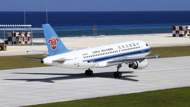A China Southern Airlines jetliner lands at the airfield on Fiery Cross Reef in the Spratly Islands of the South China Sea in January.