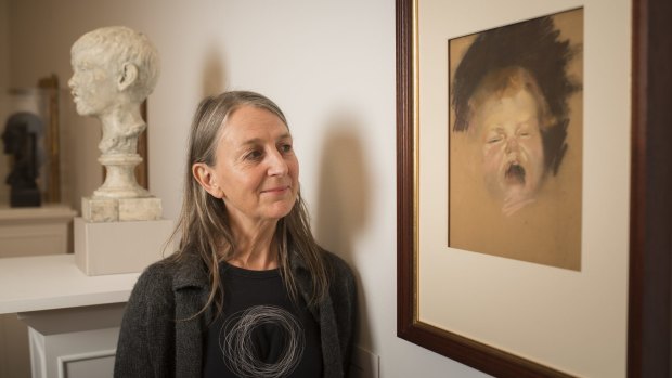 The grandaughter of Australian painter Tom Roberts, Lisa Roberts, with the work she has donated to the National Gallery of Australia. 