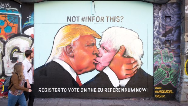 A mural that has been painted on a derelict building in Stokes Croft showing Donald Trump sharing a kiss with Boris Johnson.