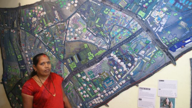 A group of women took scraps of waste denim to create a giant patchwork map of the slum.
