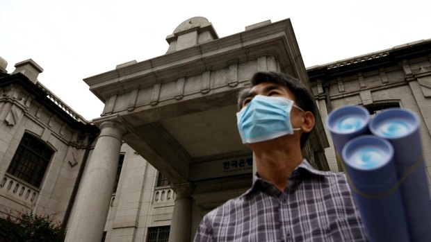 Outside the Bank of Korea museum at the central bank's headquarters in Seoul on Thursday. The Bank of Korea lowered its key interest rate to an unprecedented low as the spread of MERS risks derailing an economic recovery.