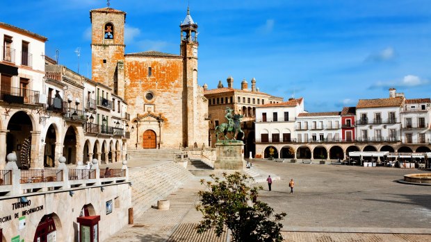 Saint Martin's Church and the statue of Francisco Pizarro in  Trujillo. 