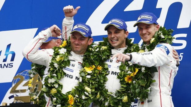 Young gun: Earl Bamber (centre) celebrates winning the 2015 Le Mans 24 Hours with teammates Nick Tandy and Nico Huelkenberg.