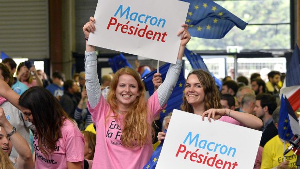 Supporters greet French Presidential Candidate Emmanuel Macron in Paris.