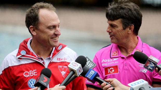 Swans' coach John Longmire and his Demons counterpart Paul Roos front up at the MCG.