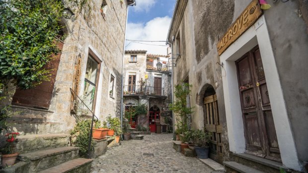 Calcata is a rabbit warren of cobbled streets, with tiny stone houses piled one on top of the other.