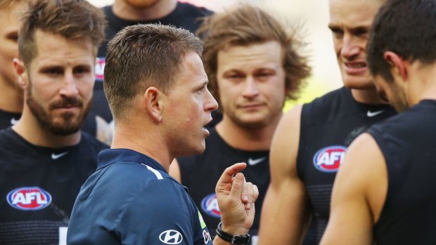 Words of wisdom: Brendon Bolton speaks to the Carlton players during a break in Sunday's game.
