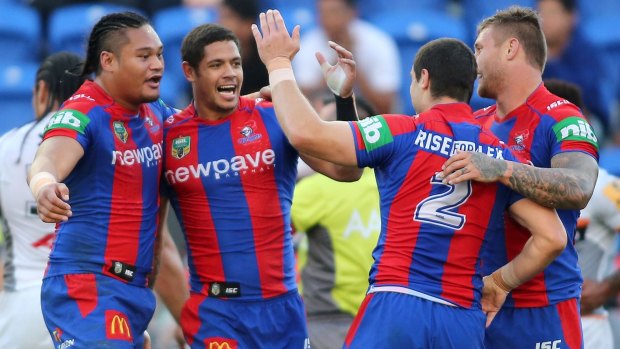 Drought broken: Knights players celebrate a try during the round 10 NRL win over Wests Tigers at Hunter Stadium.