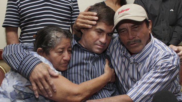 Jose Salvador Alvarenga, a fisherman who says he drifted at sea for more than a year surviving on raw fish, turtles and bird blood, is embraced by his parents after he washed ashore last year. 