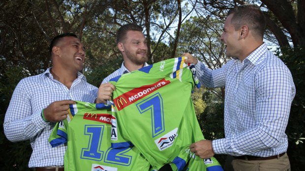 Canberra Raiders players Jeff Lima (left), Elliott Whitehead and Aidan Sezer clown around and swap their team jerseys after a presentation at the Royal Canberra Golf Club.   