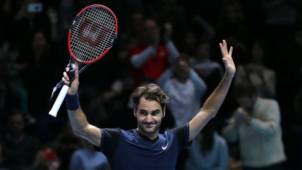 Swiss maestro: Switzerland's Roger Federer celebrates winning match point against countryman Stan Wawrinka.