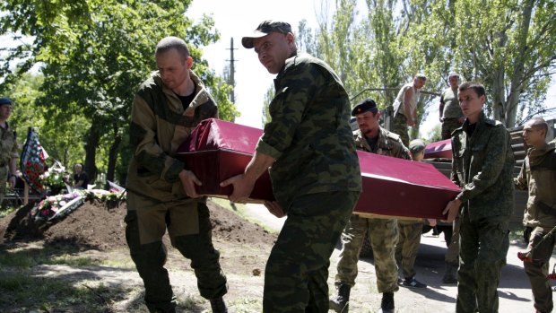 Carrying coffins at the funeral on Saturday of five fighters of the separatist self-proclaimed Donetsk People's Republic