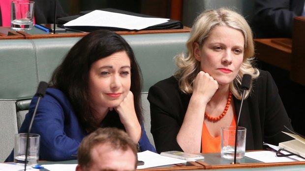 Labor MPs Terri Butler and Clare O'Neil listen during question time on Monday.