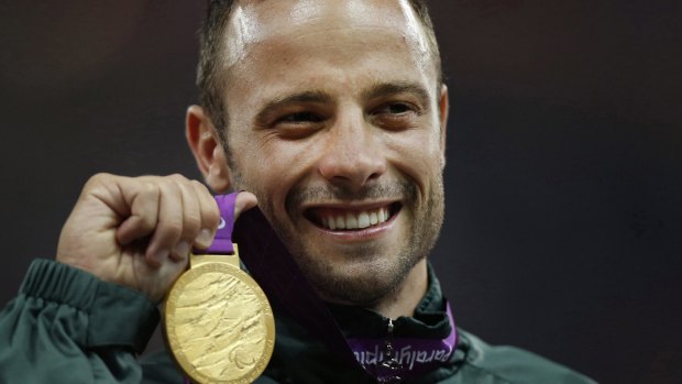Oscar Pistorius with his Paralympic gold medal from London in 2012.