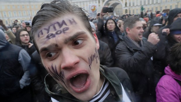 A young protester shouts slogans at Dvortsovaya (Palace) Square in St Petersburg on Sunday.