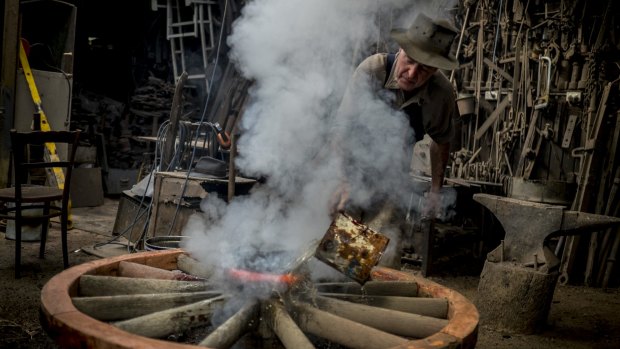 Plying his trade: Blacksmith Bernie Dingle in his Nar Nar Goon workshop.