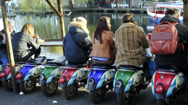 Hot seat: Scooters offer alfresco dining at Camden market.