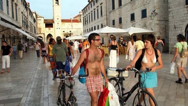 Overcrowded: Tourists walk through the Stradun, the main street in the coastal town of Dubrovnik.
