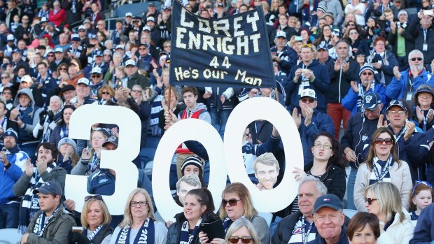 Geelong fans celebrate Corey Enright's 300th game.