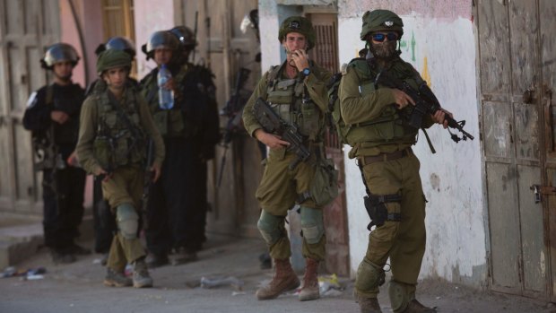 Israeli security forces during clashes in the Fawwar refugee camp near Hebron in August.