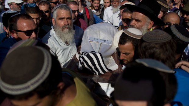 Israeli mourners carry the body of Miki Mark at his funeral in Jerusalem in July. Mark was killed in a shooting attack while driving with his family near Hebron in the occupied West Bank.