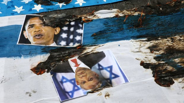 Portraits of US President Barack Obama and Israeli PM Benjamin Netanyahu and flags are set on fire by Iranian demonstrators in their annual pro-Palestinian rally marking al-Quds (Jerusalem) Day in Tehran in July.