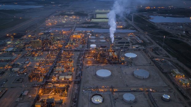 An oil sands plant in Alberta. Despite a severe economic downturn in the region, many energy companies have too much invested in the oil sands to turn off the taps. 