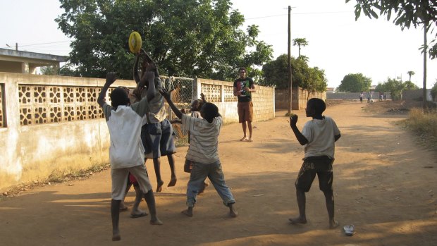 Mozambique has declared itself free of landmines ... Collingwood footballer Harry O'Brien teaches a group of Mozambique boys about Australian Rules football in 2008. 
