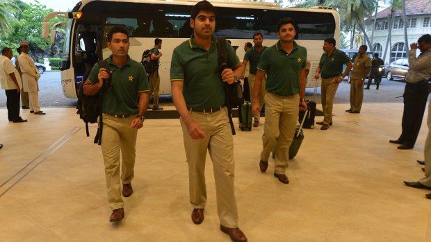 Pakistan cricketers Asad Shafiq, Haris Sohail and Azhar Ali arrive at a hotel in Colombo on Tuesday, at the start of the team's tour of Sri Lanka.