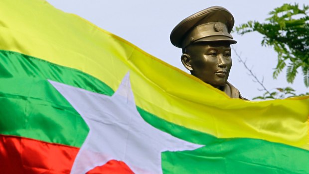 The Myanmar national flag flies in front of a statue of General Aung San during a ceremony marking the 70th anniversary of his assassination in June.