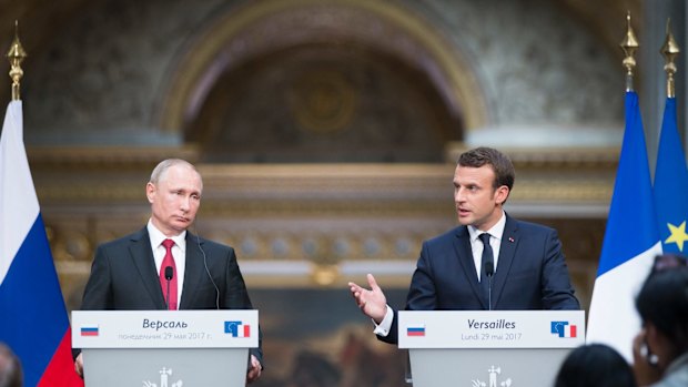 Vladimir Putin and Emmanuel Macron hold a press conference at the Palace of Versailles after their talks.