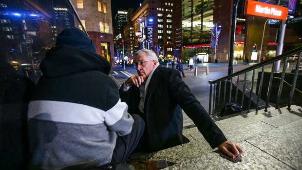 A tough question: Brad Hazzard, Minister for Social Housing, talks with homeless man "Tony" in Martin Place.