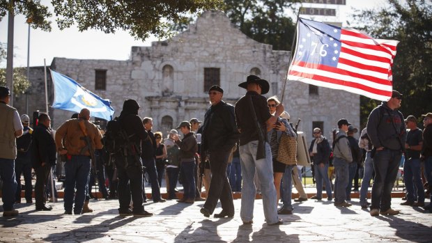Demonstrators, some with rifles, gather for a pro-gun rally at the Alamo in San Antonio in October 2013. 