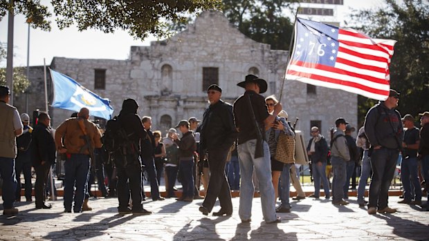 Demonstrators, some with rifles, gather for a pro-gun rally at the Alamo in San Antonio in October 2013. 