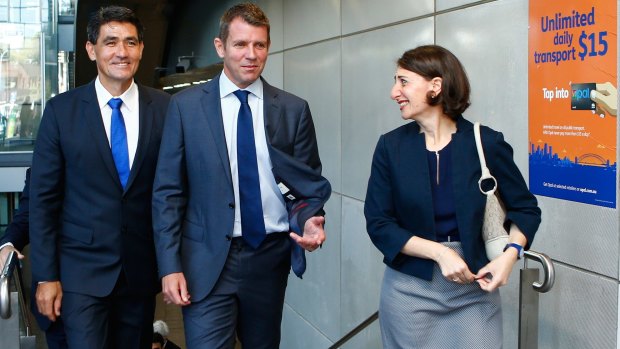 NSW Premier Mike Baird, Parramatta MP Geoff Lee and NSW Minister for Transport Gladys Berejiklian leave Parramatta Station after announcing new transport measures  on Monday.