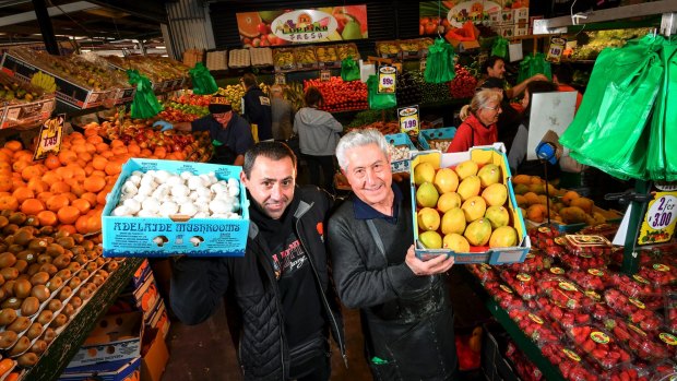 Danny Luppino, with son Dominic, has been a fruit and vegetable stallholder at Dandenong Market for 54 years. 