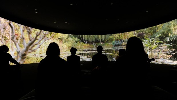 A 180-degree video installation on a curved screen at the NGV's Monet's Garden exhibition.
