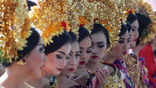 Women in traditional dress during the Bali Arts Festival. The month-long runs through June.