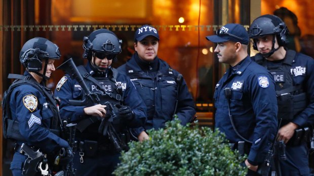 Members of the NYPD's counter-terrorism unit guard Trump Tower in New York 24/7.