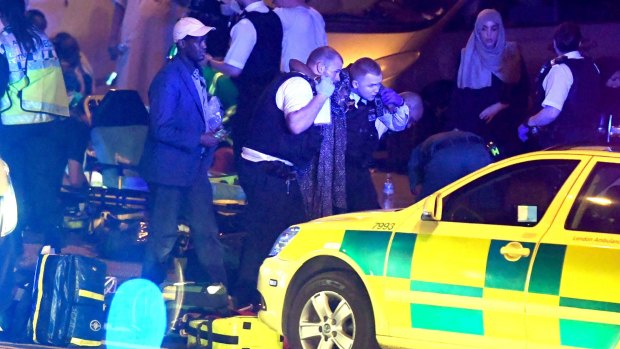 Police and paramedics at the scene of the attack in Finsbury Park, north London.